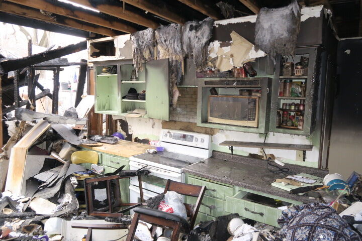 Wreckage of home following fire set by husband